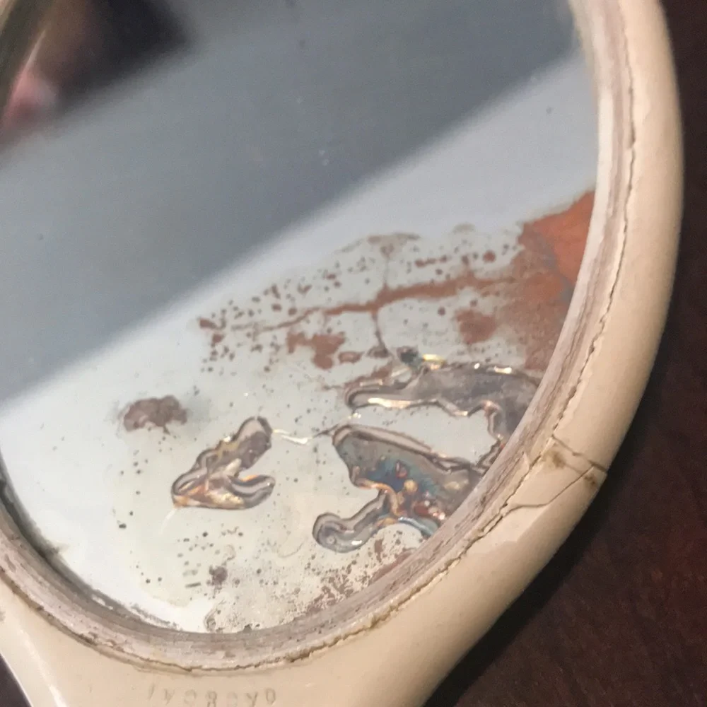 Antique hand held mirror in original dresser box